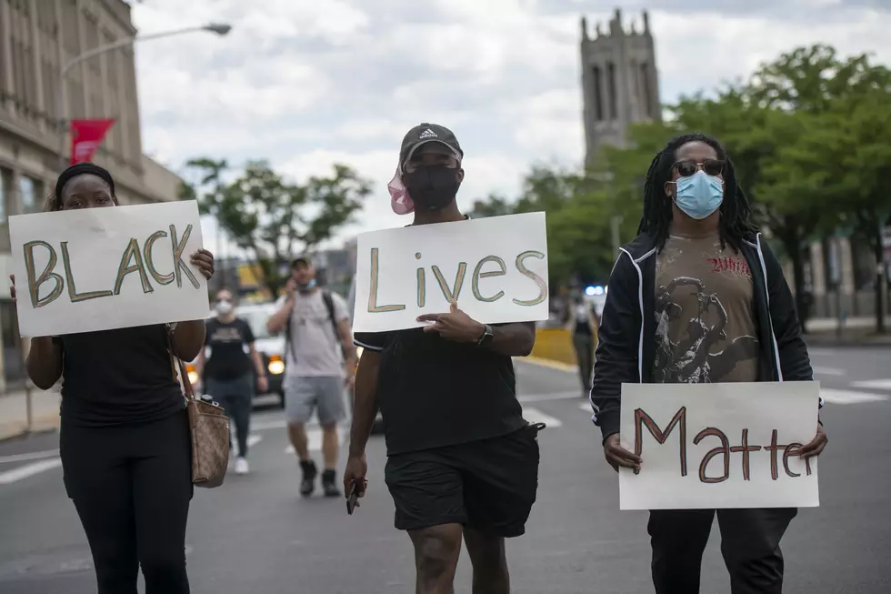 Watch The Disgusting Reactions To A White Man Holding A BLM Sign